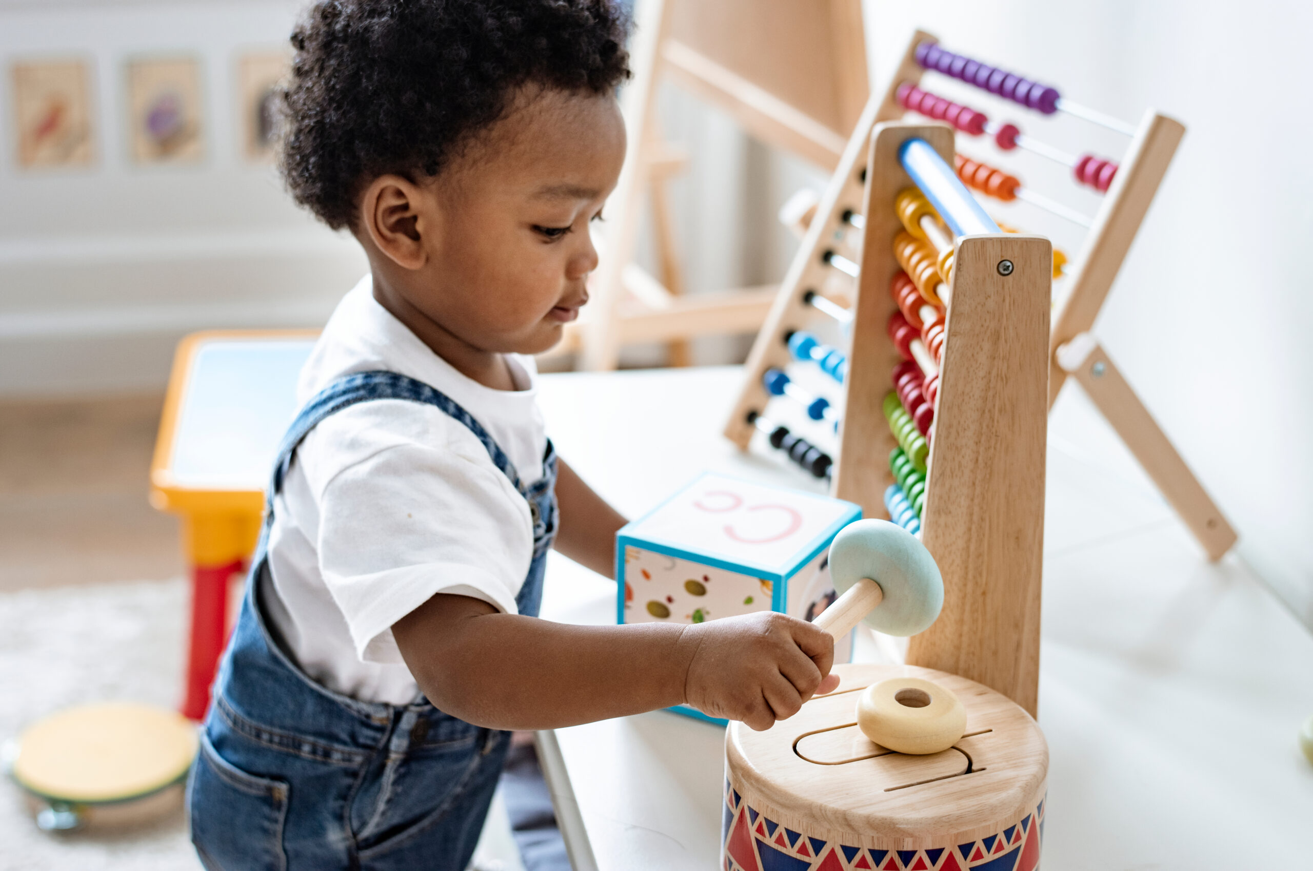 Young boy playing with a drum